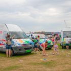 Children painting three vans