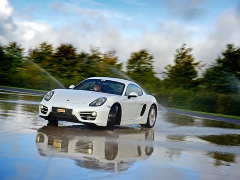 White Porsche Cayman on Skid Pan
