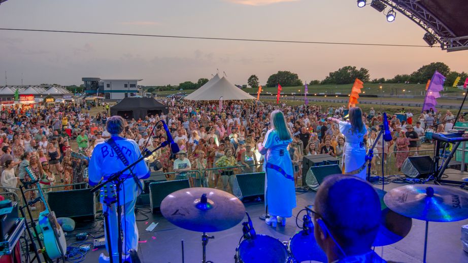 Bjorn Again performing to a crowd at Thruxton Retro