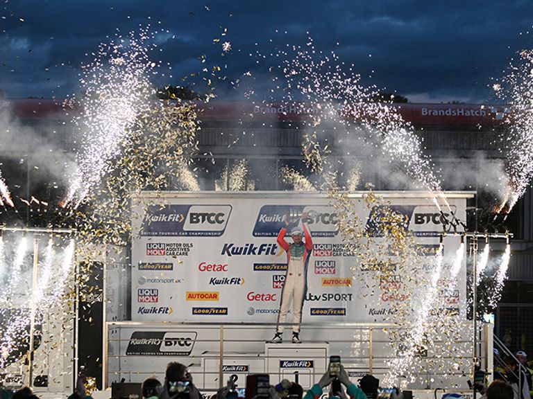 Tom Ingram lifting the BTCC trophy