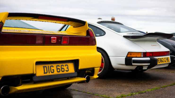 Yellow Honda and White Porsche
