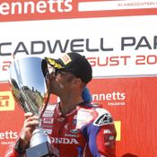 Tommy Bridewell kissing a trophy