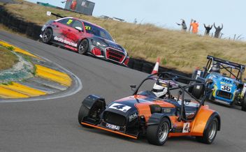 three racing cars on track