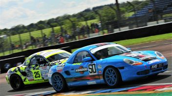 Two Porsche racing on track