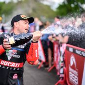 Leon Haslam spraying champagne