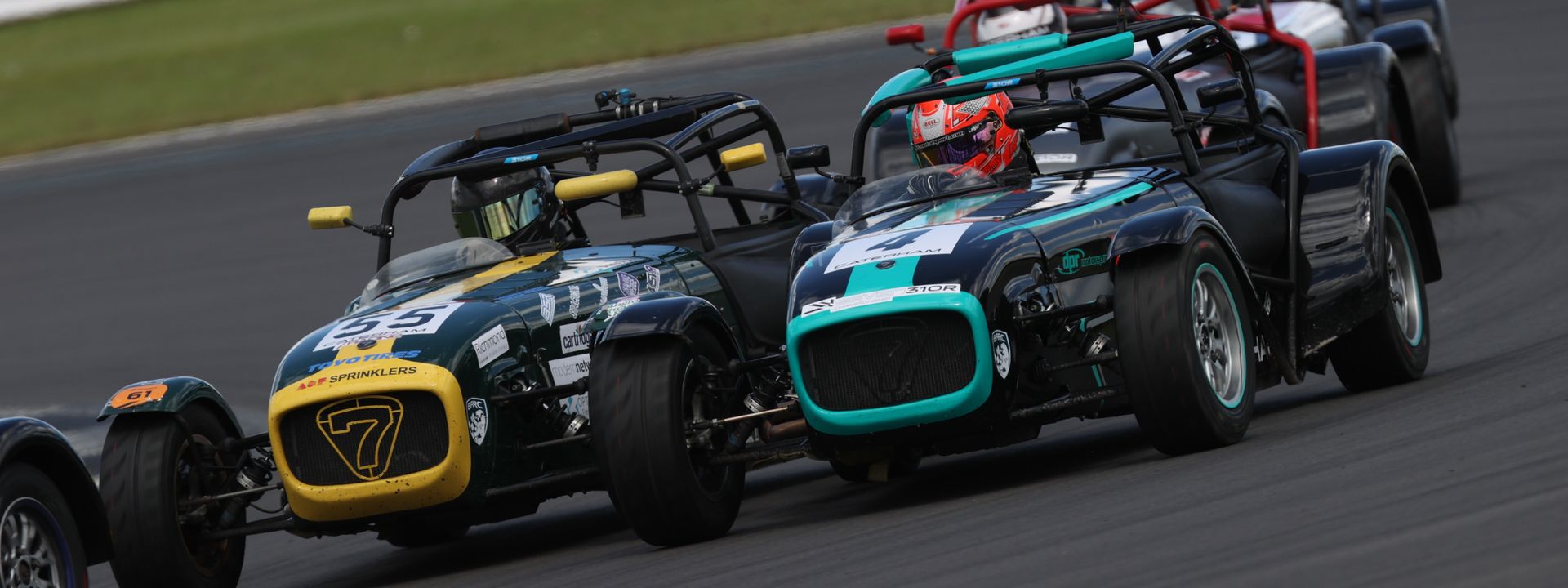 Caterham contingent battle it out around Cadwell Park.