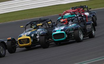 Caterham contingent battle it out around Cadwell Park.